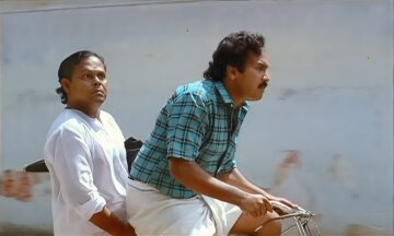 Innocent and KB Ganesh Kumar on bicycle (ഇന്നസെന്റും ഗണേഷ് കുമാറും സൈക്കിളിൽ പോകുന്നു)